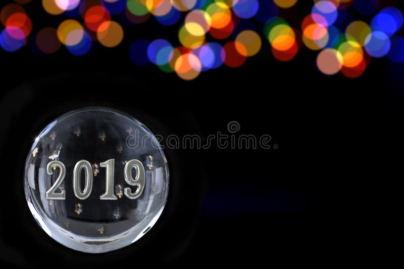 2019 in a Powerful magic sphere,Fortune teller,mind power concept on black background with lbue and gold blurry light stock images 2019 in a Powerful magic sphere,Fortune teller,mind power concept on black background with lbue and gold blurry light stock images