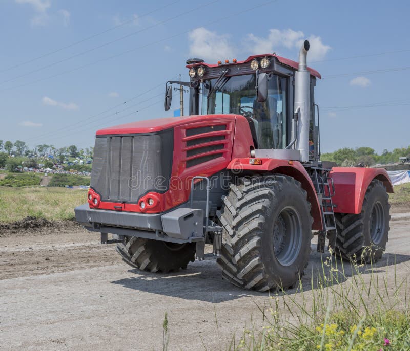 Russian Old Tractor In The Village In The Mountains With Summer Stock