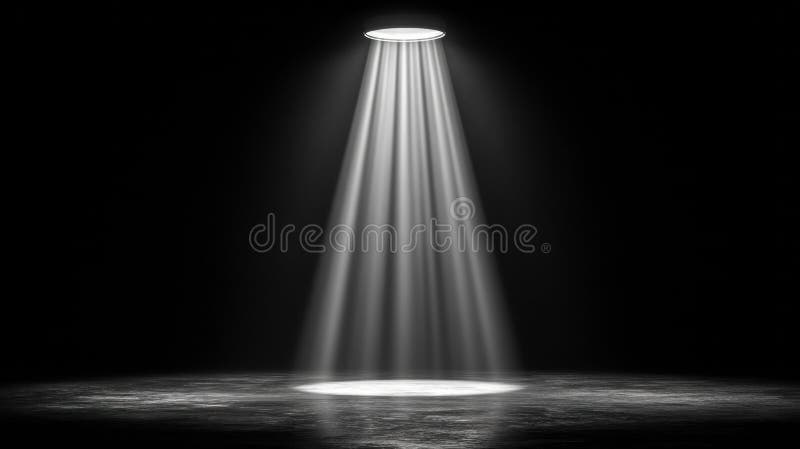 A powerful spotlight shines down on a dark stage, creating a dramatic atmosphere with its bright beam. stock photo