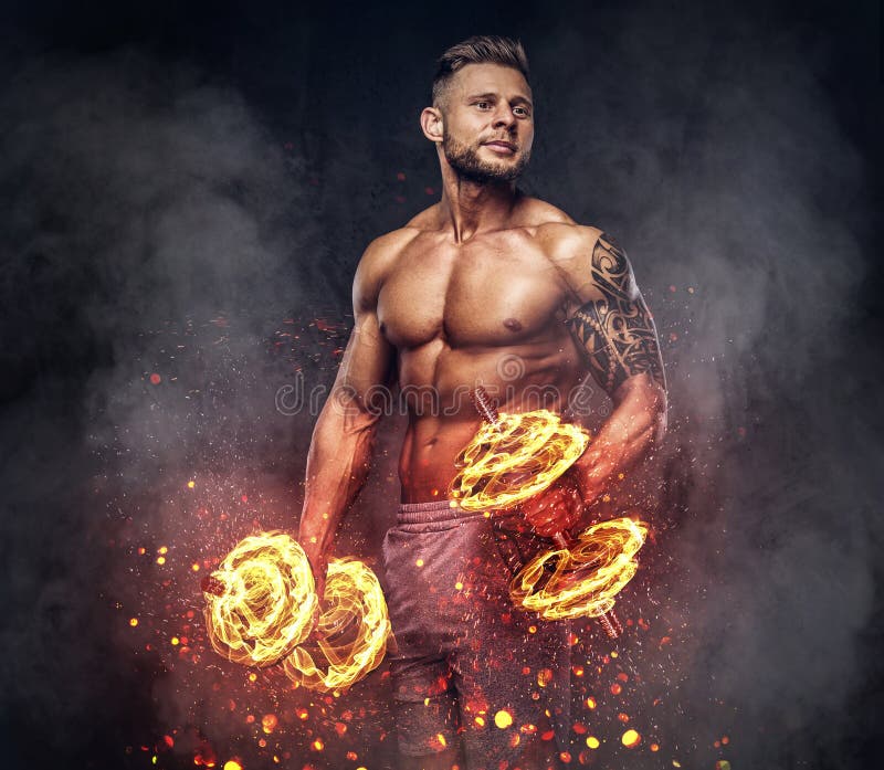 Handsome Shirtless Tattooed Bodybuilder with Stylish Haircut and Beard,  Wearing Sports Shorts, Posing in a Studio. Fire Stock Photo - Image of  bodybuilder, bearded: 121669588