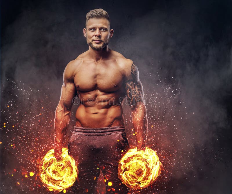 Handsome Shirtless Tattooed Bodybuilder with Stylish Haircut and Beard,  Wearing Sports Shorts, Posing in a Studio. Fire Stock Photo - Image of  indoor, bodybuilder: 121669730