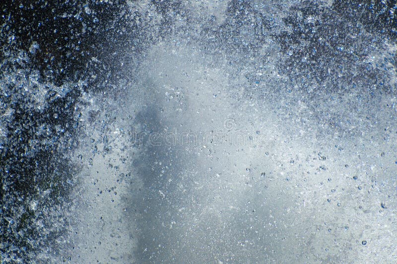 Powerful water splash creating dynamic abstract pattern royalty free stock images