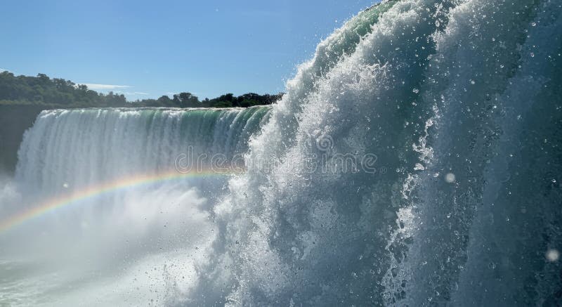 Powerful Waterfall with Rainbow and Mist royalty free illustration