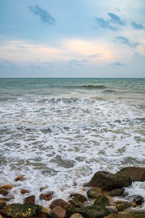 Powerful wave from sea with Rock on the beach before raining storm royalty free stock photos Powerful wave from sea with Rock on the beach before raining storm royalty free stock photos