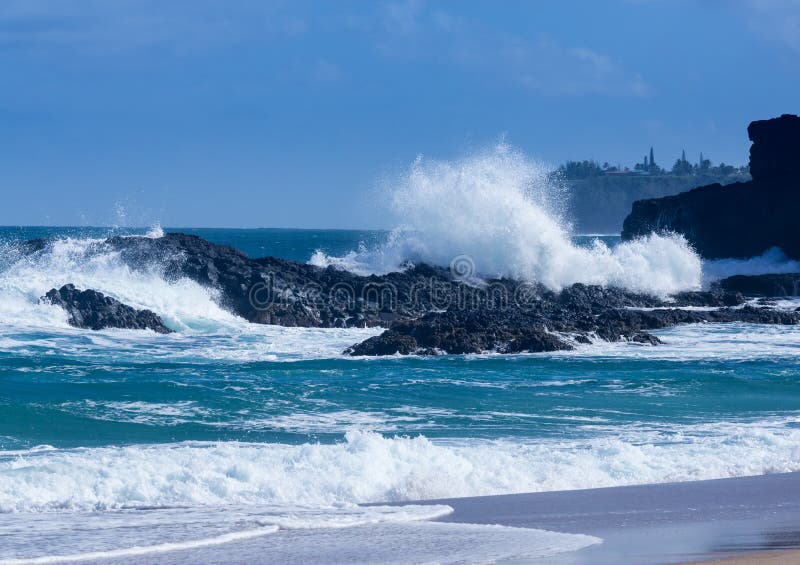 Powerful waves flow over rocks at Lumahai Beach, Kauai