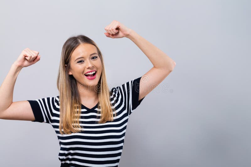 Powerful young woman in success pose royalty free stock images Powerful young woman in success pose royalty free stock images