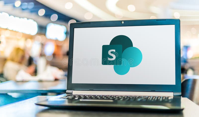 Laptop computer displaying logo of SharePoint royalty free stock image
