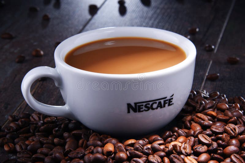 Composition with cup of Nescafe coffee beans