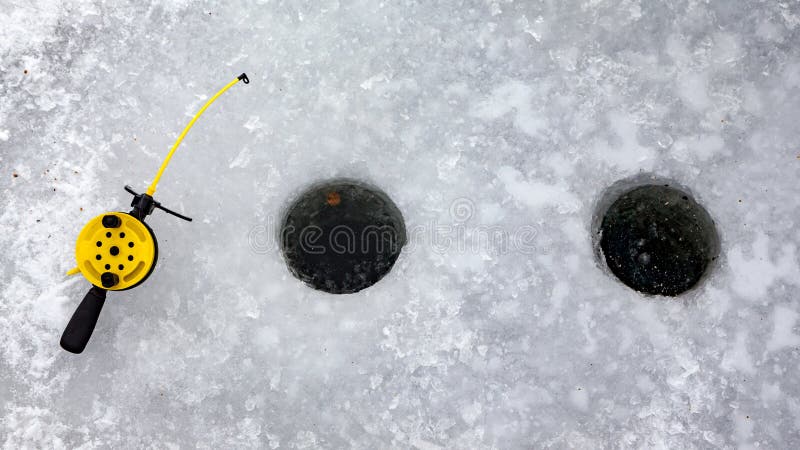 An Ice-hole and a little plastic rod for winter fishing. An Ice-hole and a little plastic rod for winter fishing.