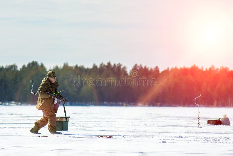 Winter fishing. Ice fishing. Leisure. Winter landscape. Fisherman on ice lifestyle. Winter fishing. Ice fishing. Leisure. Winter landscape. Fisherman on ice lifestyle