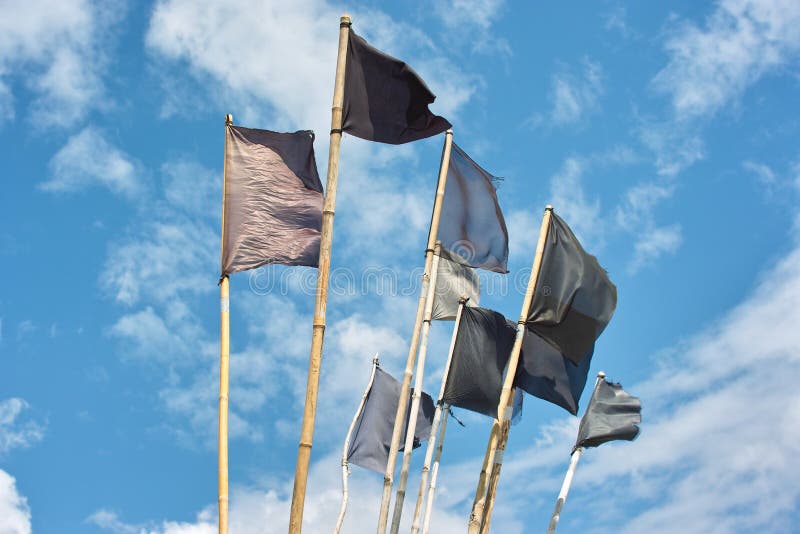 Fishing buoy pennants on the blue sky. Fishing buoy pennants on the blue sky.