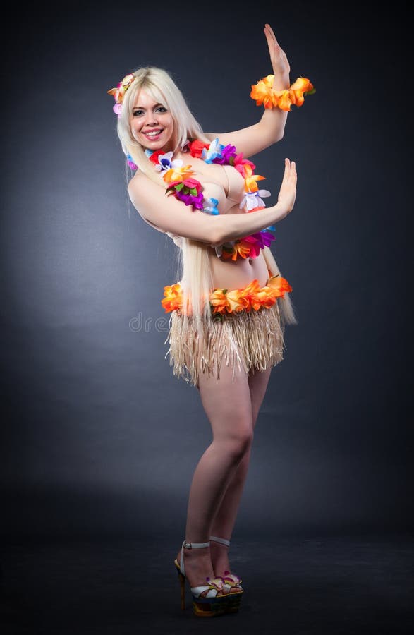 Beautiful smiling woman in Hawaii style on a black background. Beautiful smiling woman in Hawaii style on a black background