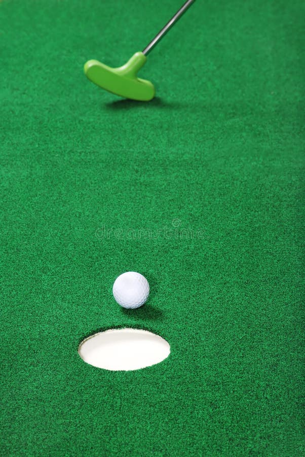 Golf practice putting hole stock image. Image of exercise 5004237