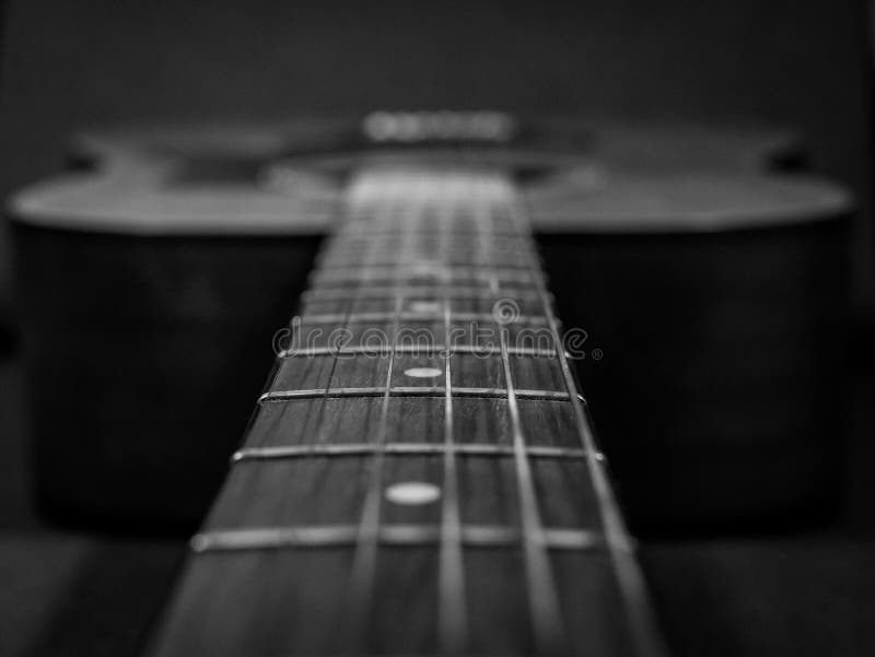 Practice Playing the Acoustic Guitar. Hands Playing Guitar and Picking Chords Stock Image
