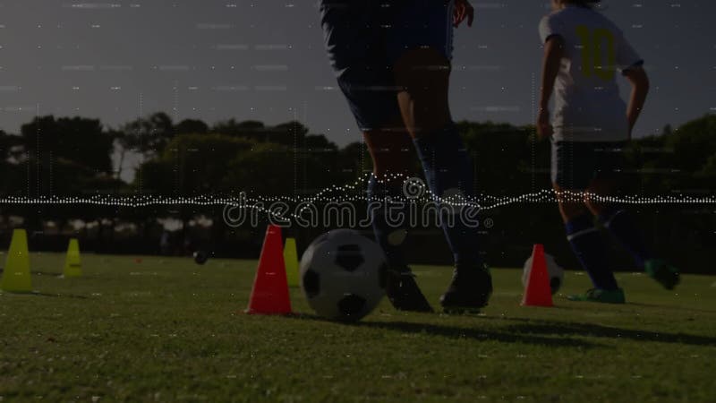 Practicing soccer on field, players with animation data visualization overlay stock video footage