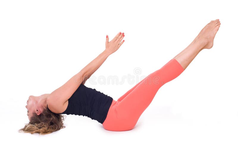 Practicing Yoga exercises / Boat Pose - Navasana stock image Practicing Yoga exercises / Boat Pose - Navasana stock image