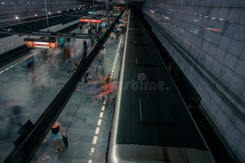 Prague, Czech Republic,23 July 2019; People at metro station entering subway train or walking by, long exposure technique for