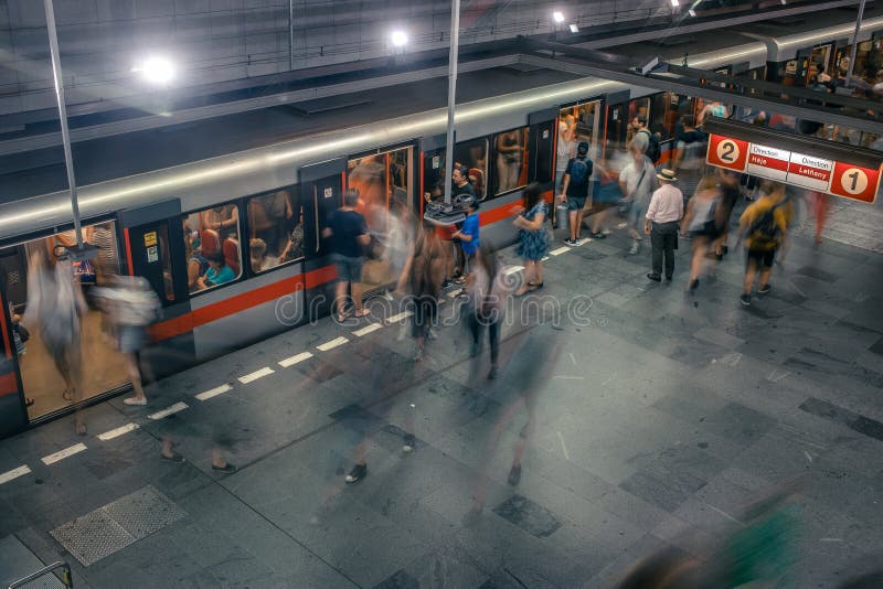 Prague, Czech Republic,23 July 2019; People at metro station entering subway train or walking by, long exposure technique for