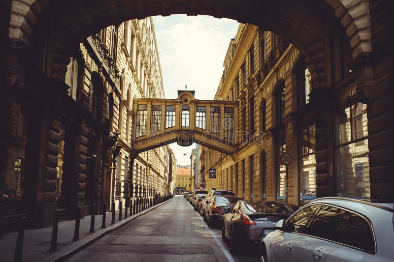 Cozy and beautiful tourist street of old architecture parked cars