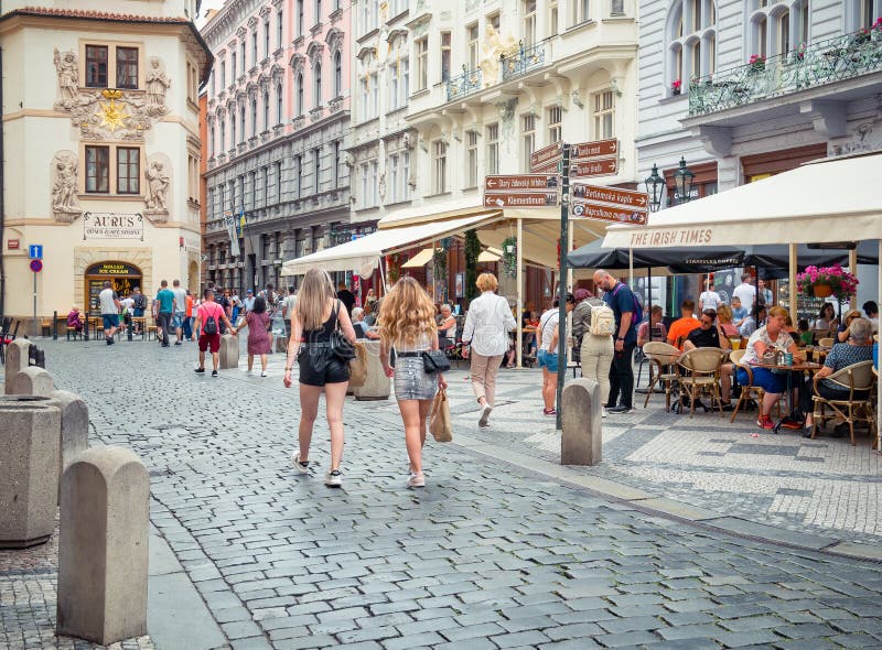 Pedestrian Cobblestone Street with Outdoor Restaurants and Cafe in the ...