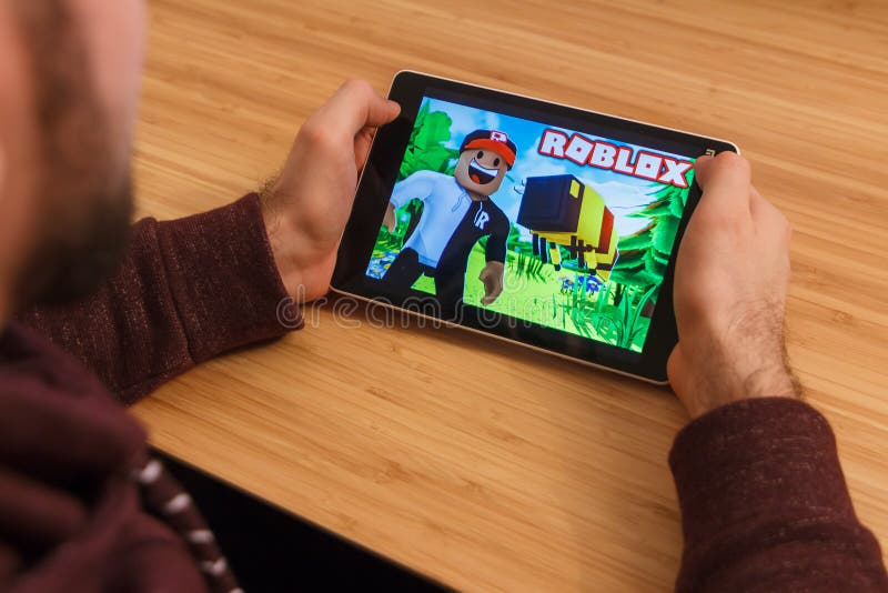 Prague Czech Republic March 16 2019 Man Holding A Smartphone And Playng The Roblox Mobile Game An Illustrative Editorial Editorial Photo Image Of Application Editorial 142219401 - free roblox accounts 2019 march
