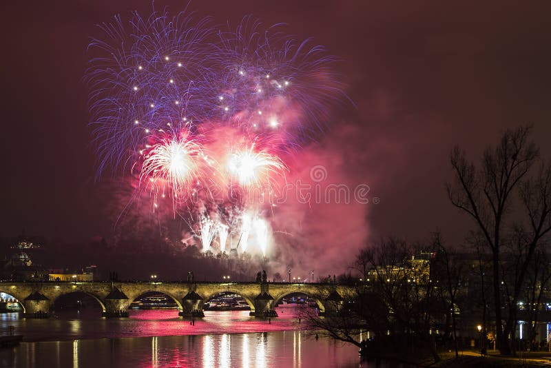 Prague New Year fireworks over Charles bridge and the river Vltava (Moldau)