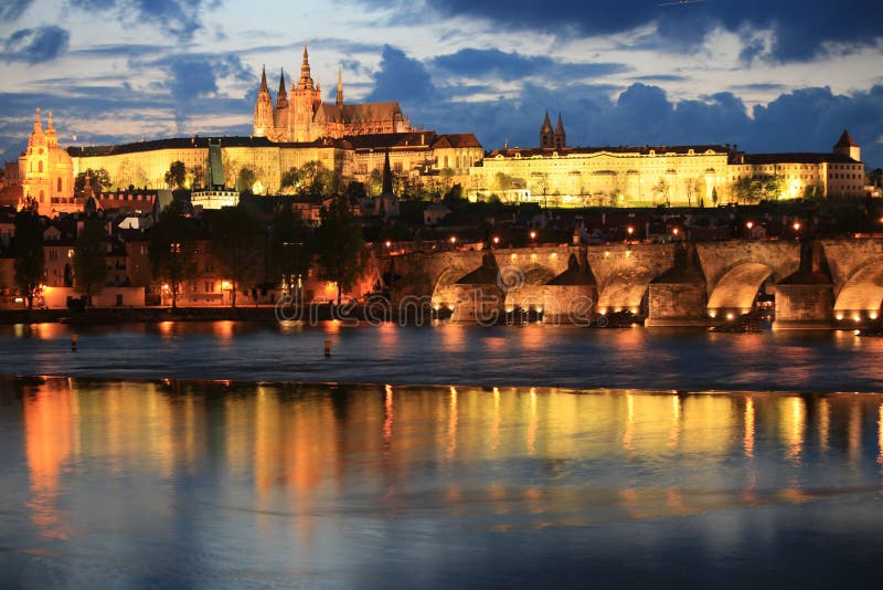 Panoramic night view to Lesser Town, Prague castle, St. Nicholas church and Charles bridge. Panoramic night view to Lesser Town, Prague castle, St. Nicholas church and Charles bridge.