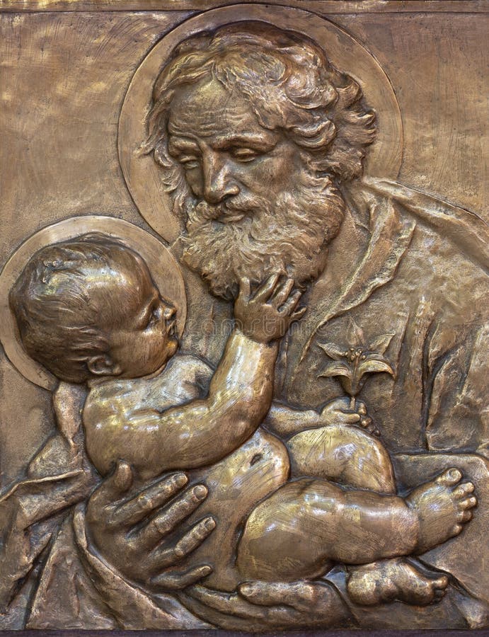 PRAGUE, CZECH REPUBLIC - OCTOBER 13, 2018: The bronze relief of St. Joseph in church kostel Svatého Václava by Emanuel Kodet 1914. PRAGUE, CZECH REPUBLIC - OCTOBER 13, 2018: The bronze relief of St. Joseph in church kostel Svatého Václava by Emanuel Kodet 1914