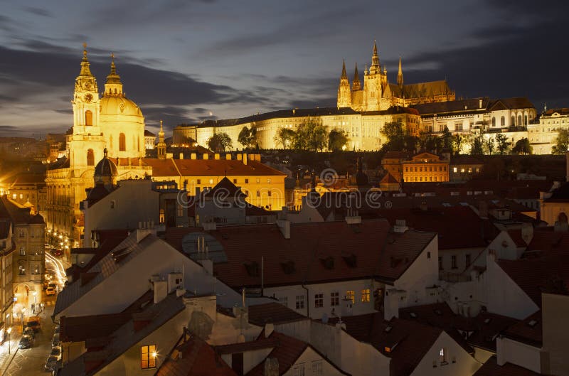 Prague - Czech Republic - The St. Nicholas church, Mala strana, Castle and Cathedral at dusk. Prague - Czech Republic - The St. Nicholas church, Mala strana, Castle and Cathedral at dusk