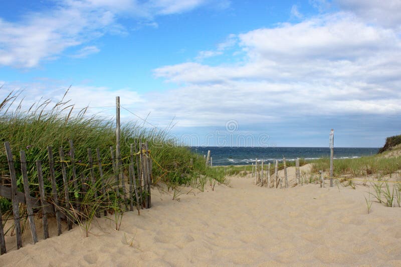 A pathway to the beach through the dunes at head of the Meadow Beach, Truro, Cape cod. A pathway to the beach through the dunes at head of the Meadow Beach, Truro, Cape cod.