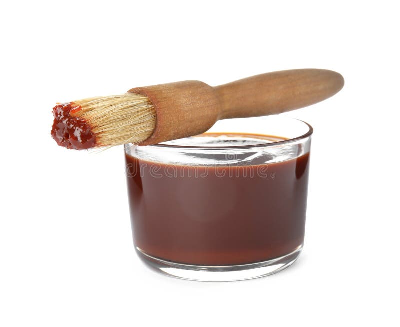 Glass dish of barbecue sauce with basting brush on white background. Glass dish of barbecue sauce with basting brush on white background