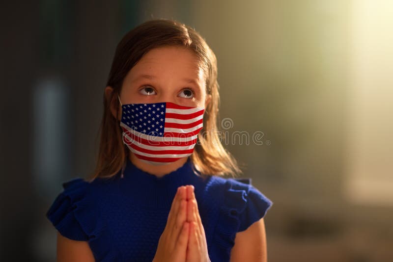Pray for America. Child in face mask praying