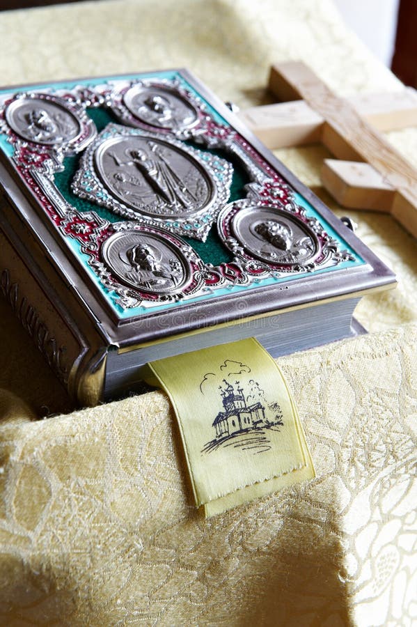 Prayer bible and wooden cross on table in Church