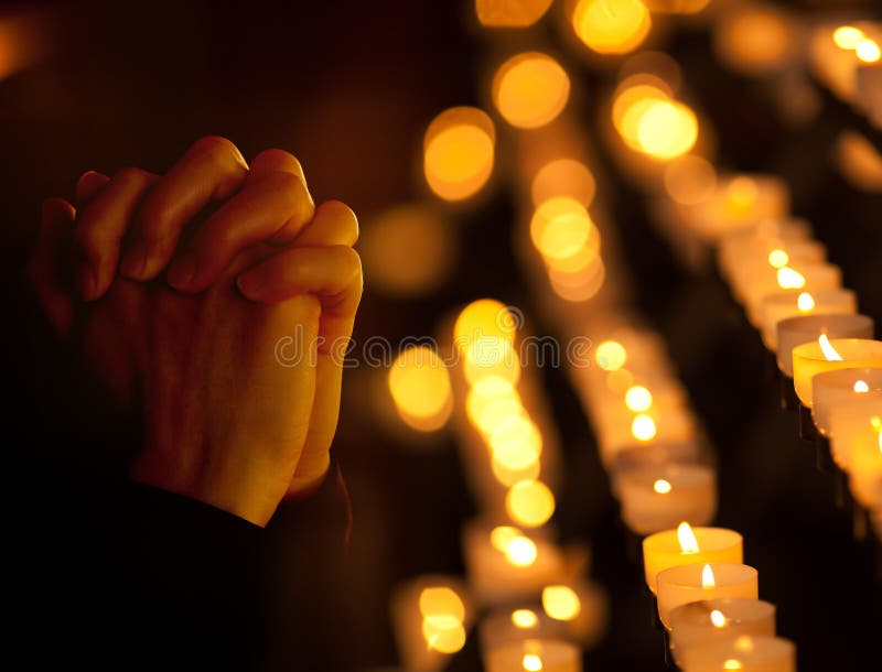 Praying in catholic church. Religion concept. stock photos