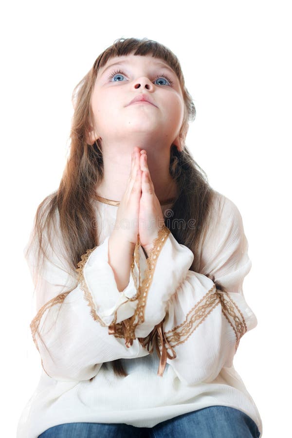 Little girl praying. Isolated on the white. Little girl praying. Isolated on the white