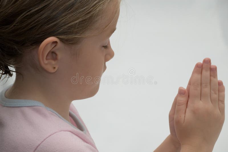 A little girl praying to God. A little girl praying to God