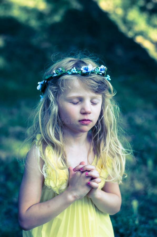 Adorable little girl praying vow. Adorable little girl praying vow