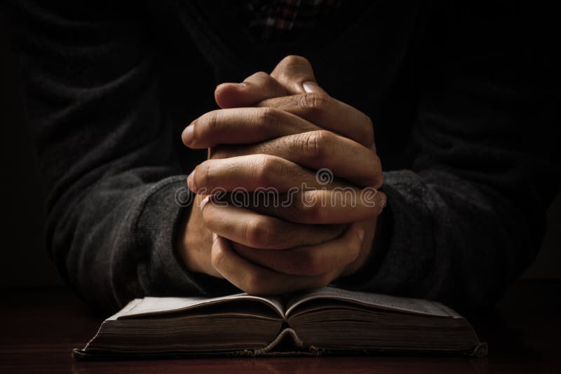 Praying Hands With Bible stock image Praying Hands With Bible stock image