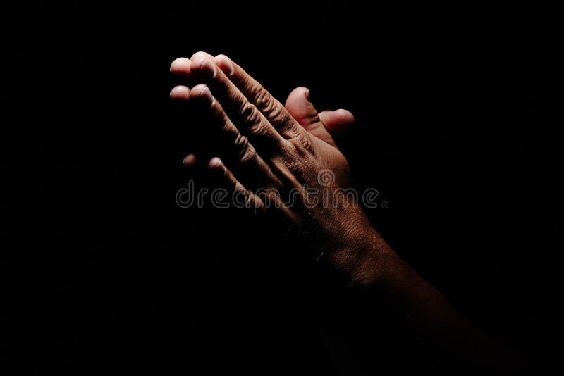 Praying Hands in black background