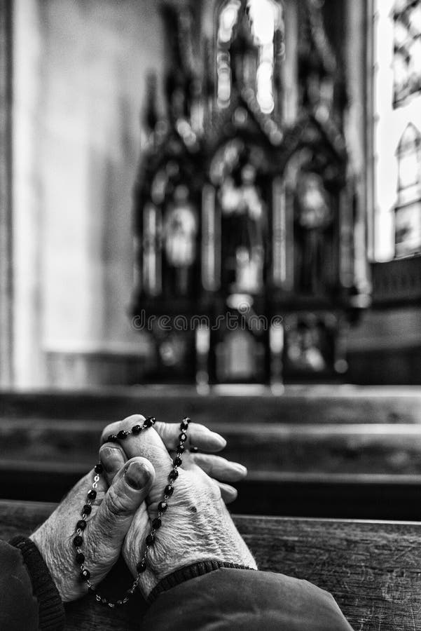 Praying Hands with Rosary in Church Stock Photo - Image of wrinkled, praying:  142582878