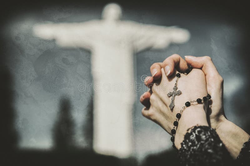 prayer hands with rosary