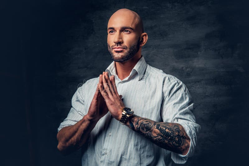 Shaved Head, Muscular Male with Tattoos on His Torso Over Grey V Stock ...