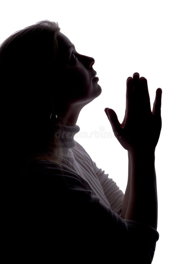 Praying silhouette royalty free stock image