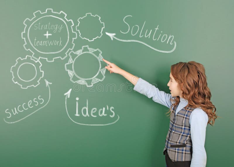 Pre-adolescent girl points finger at the main components of the solution stock photos