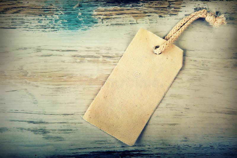 Precio de la lona con el fondo de madera imágenes de archivo libres de regalías Precio de la lona con el fondo de madera imágenes de archivo libres de regalías