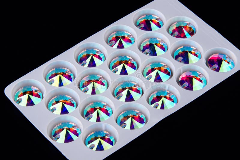 Precious stones crystals in the shape of circle in storage plate royalty free stock photography