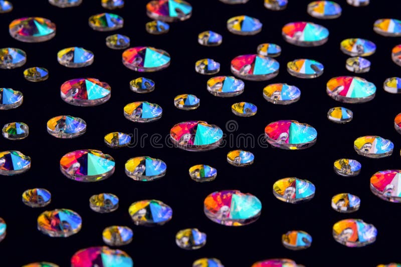 Precious stones crystals in the shape a rivoli on a black background. stock image