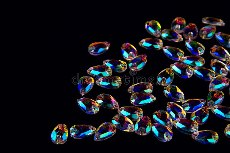 Precious stones crystals in the shape a tear drop on a black background. royalty free stock photos