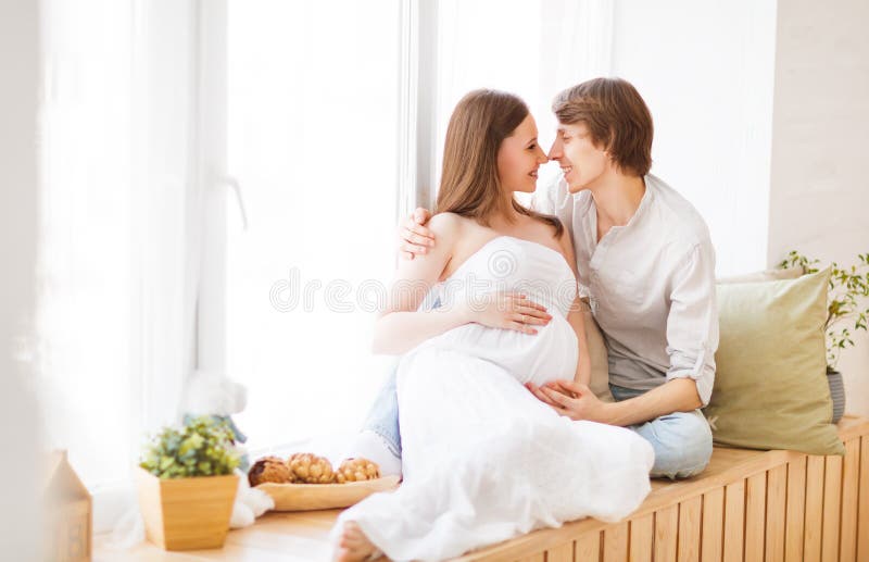 pregnancy. happy family future parents pregnant mother and father stock photos pregnancy. happy family future parents pregnant mother and father stock photos