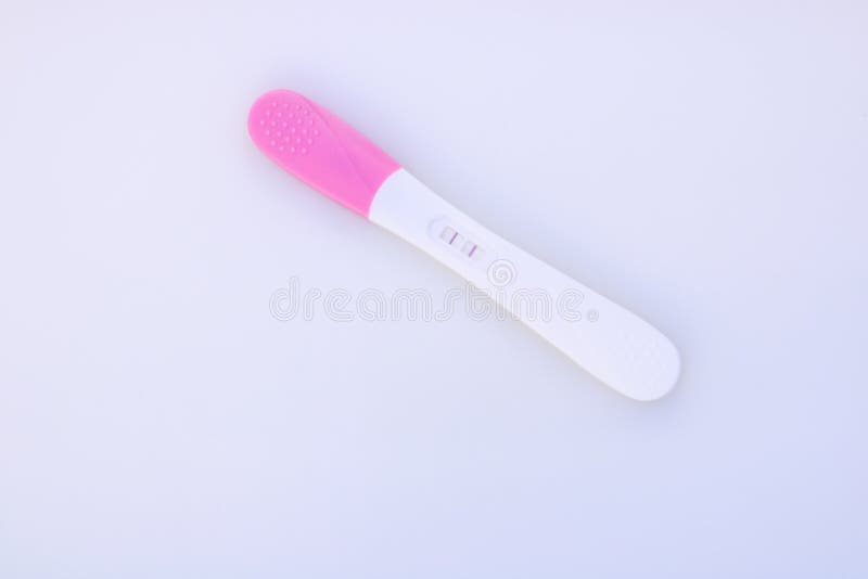 Pregnancy Test Showing a Positive Result and Ultrasound Image. Stock